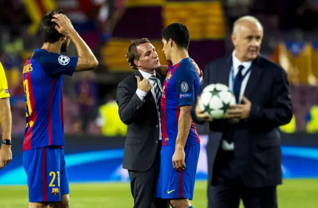 Brendan Rodgers speaks to Barcelona scorer Luis Suarez after the match at Camp Nou