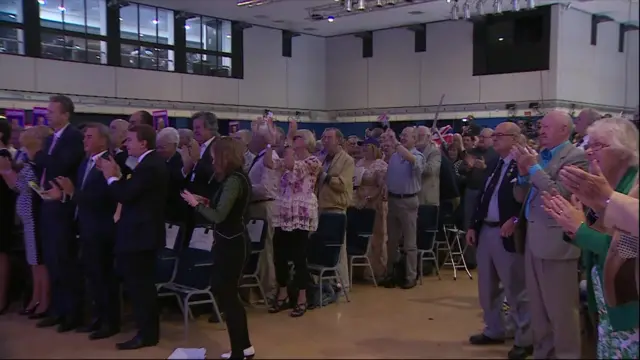 UKIP activists applaud Nigel Farage