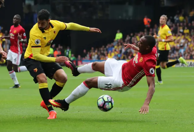 Miguel Britos tackles Anthony Martial