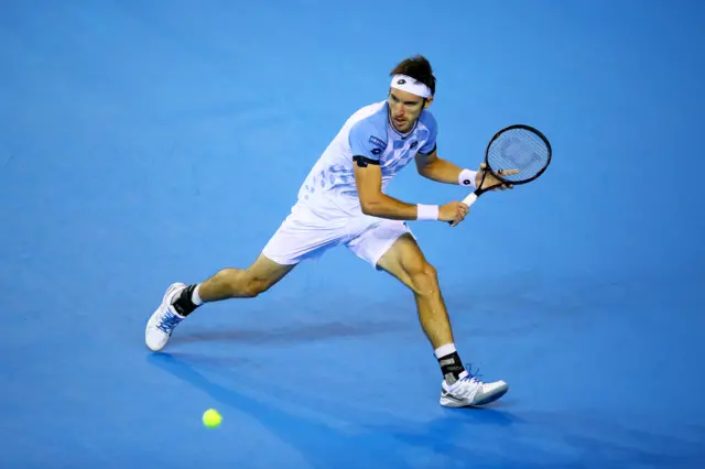 Leonardo Mayer of Argentina hits a backhand