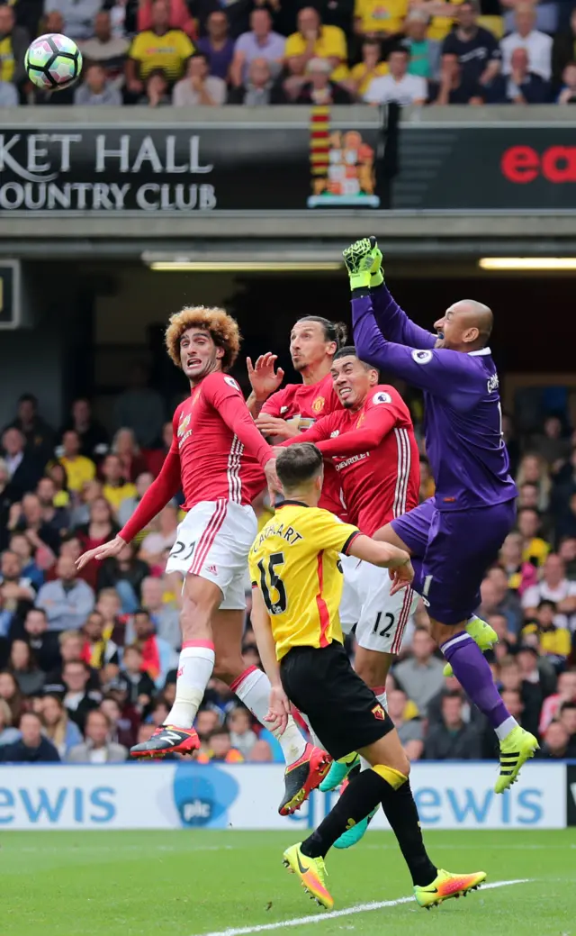 Heurelho Gomes punches the ball