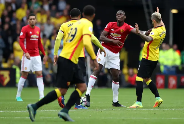 Paul Pogba pushes Valon Behrami