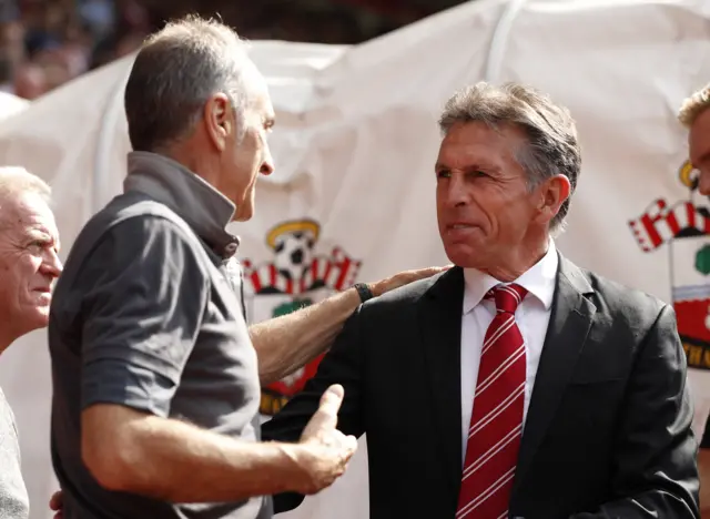 Guidolin and Puel shake hands before the match