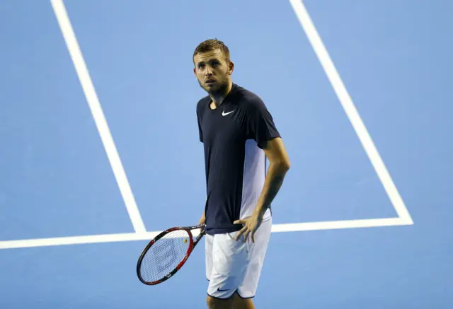 Dan Evans looks on