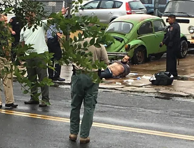 Ahmad Khan Rahami is taken into custody after a shootout with police Monday, Sept. 19, 2016, in Linden, N.J