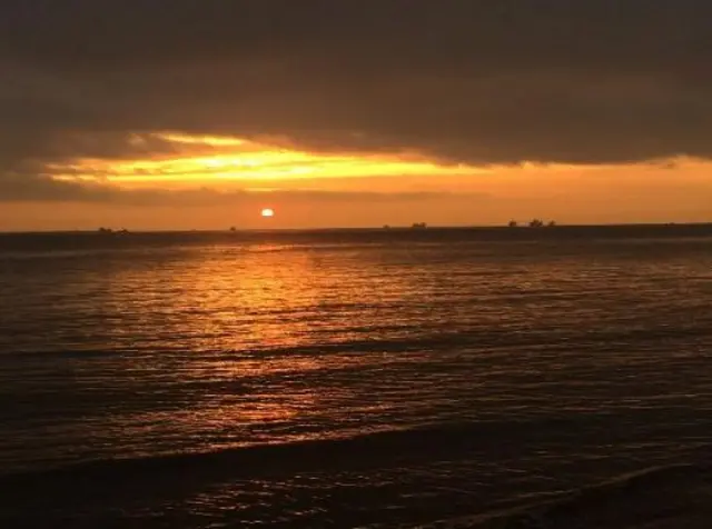 The sun rising over the sea in Cleethorpes