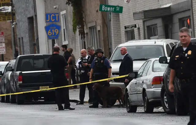 Law inforcement officers secure the area where they allegedly arrested terror suspect Ahmad Khan Rahami following a shootout in Linden, New Jersey, on September 19, 2016