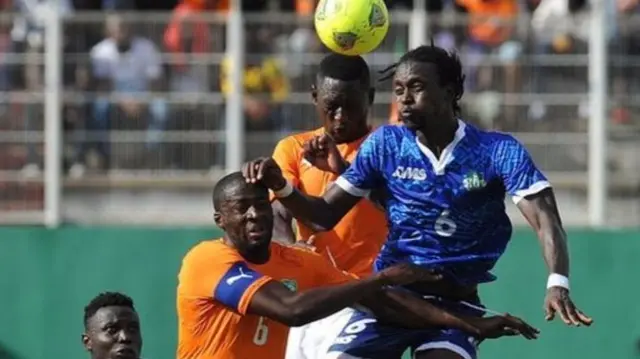 Ivory Coast and Sierra Leone football players