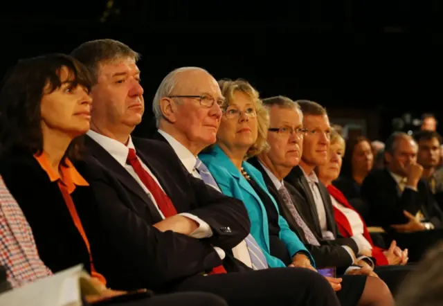 Alistair Carmichael and other Lib Dem grandees watch Mr Farron's speech