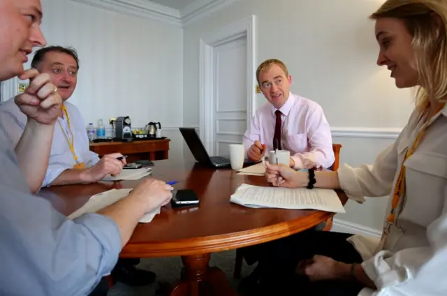 Tim Farron and advisers working on his speech