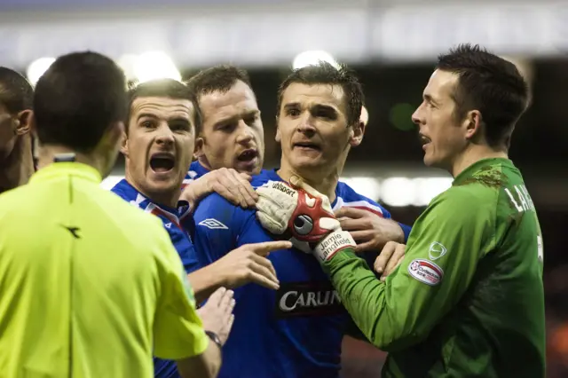 December 2007: Barry Ferguson (left) remonstrates with referee Kenny Clark as he sends off Rangers midfielder Lee McCulloch in a 1-1 draw at Pittodrie