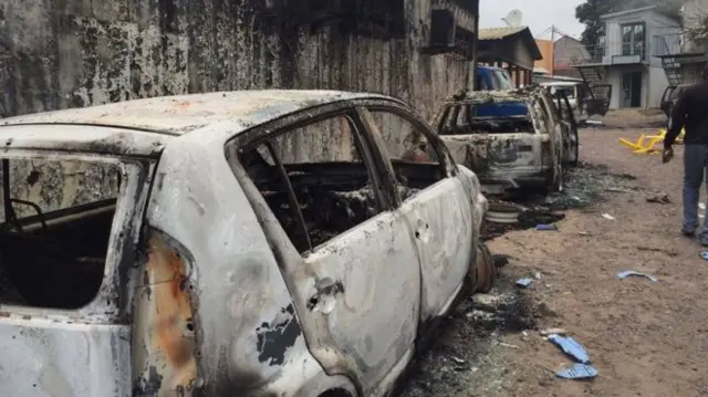 burnt out car outside the opposition HQ