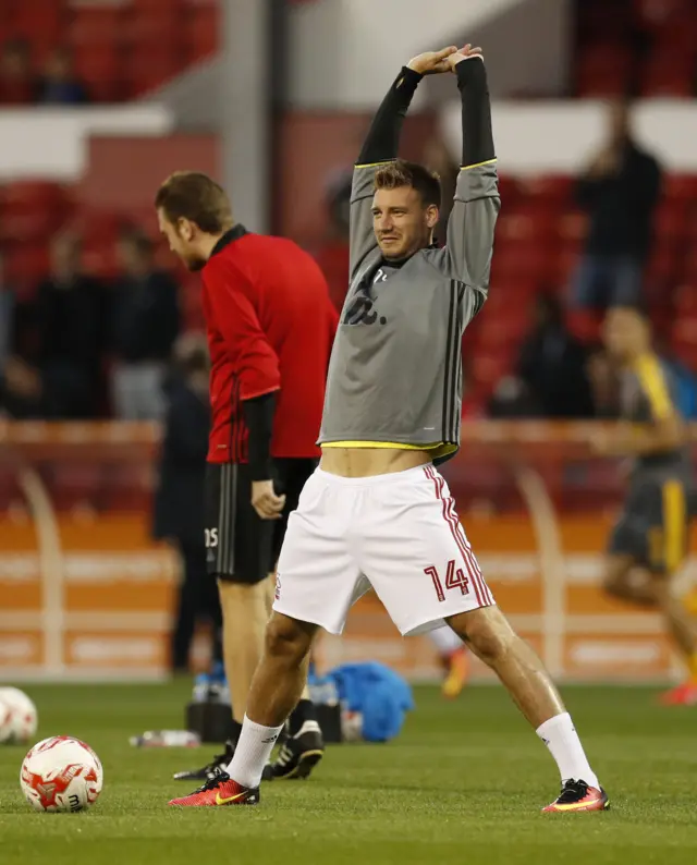 Bendtner warms up