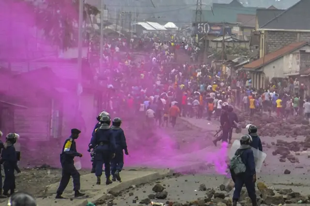 police fire purple teargas at protesters