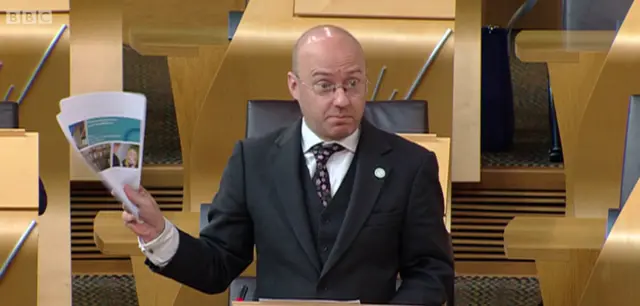 Patrick Harvie brandishes the Committee on Local Tax Reform's report