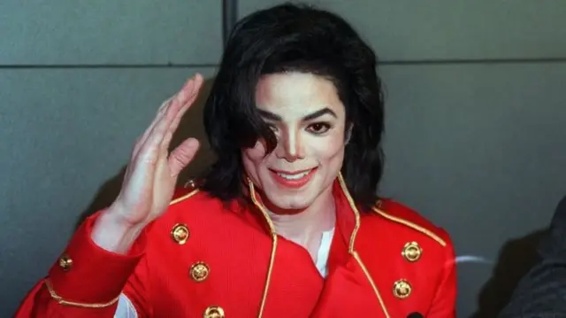 Michael Jackson in trademark red jacket