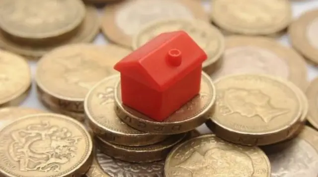 Monopoly house on coins