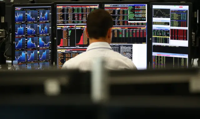 Trader at desk