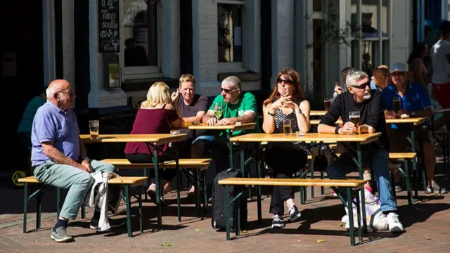 Drinkers in the sun