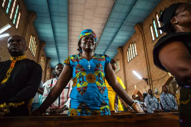 woman in church cries