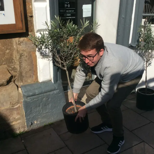 Calum picks up plant