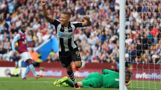 Dwight Gayle celebrates Tommy Elphick's own goal