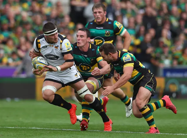 Guy Thompson of Wasps breaks clear of Louis Picamoles of Northampton Saints