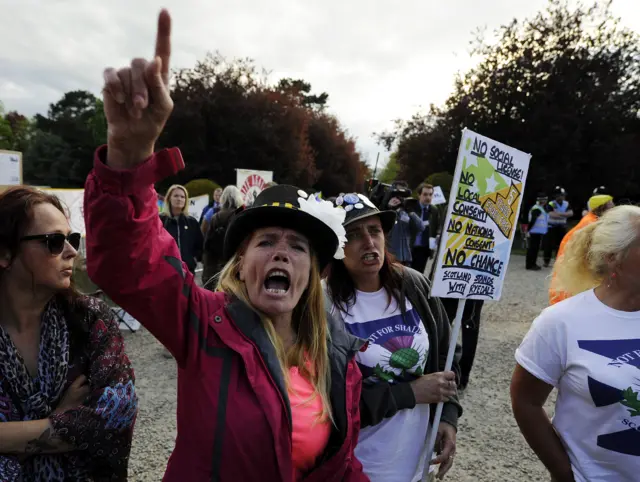 Protestors demonstrating against fracking, react outside County Hall, Northallerton, as councillors have approved an application by UK firm Third Energy to frack for shale gas near the village of Kirby Misperton, North Yorkshire.