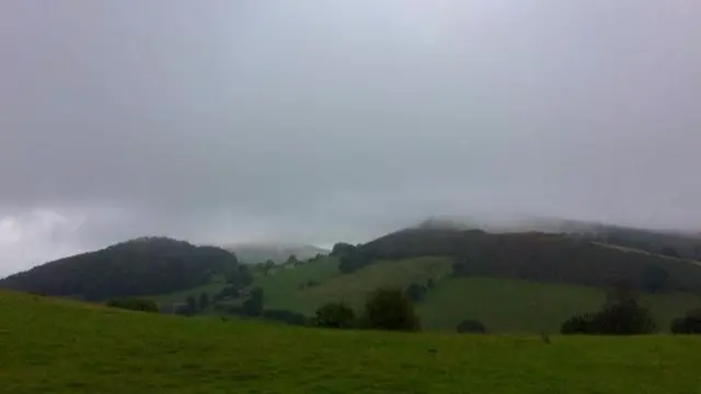 Clouds over hills