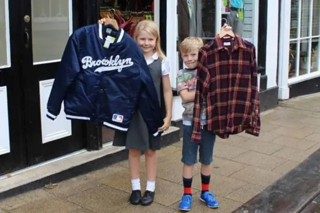 Ed Sheeran fans hold up his clothes