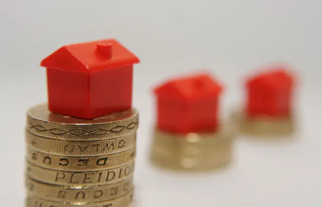 Model house and coins