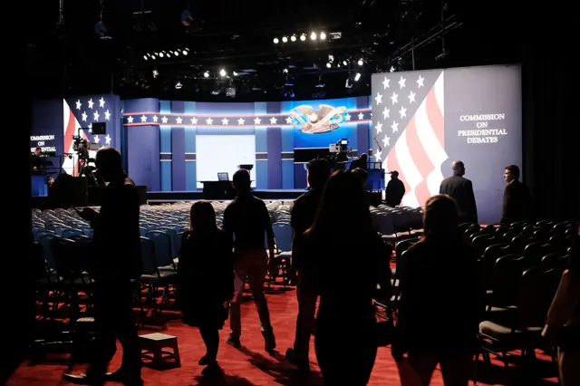 People walk into the debate hall at Hofstra University hours before the programming begins in Hempstead, New York.