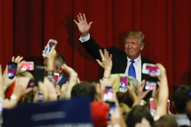 Republican presidential candidate Donald Trump waves to the crowd at a fundraising event in Lawrenceville, New Jersey.