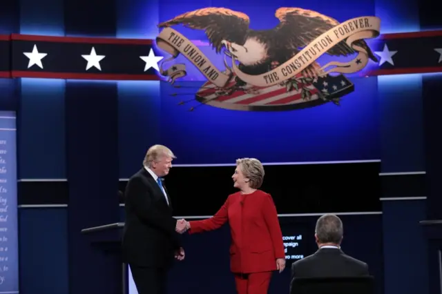 Trump and Clinton shake hands