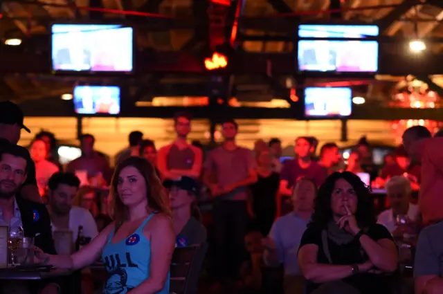 Clinton supporters watch the debate at a bar in West Hollywood, California