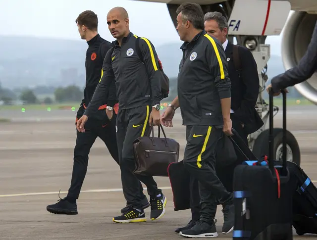 Pep Guardiola and Manchester City arrive at Glasgow Airport