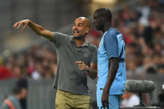 Manchester City manager Pep Guardiola and Yaya Toure