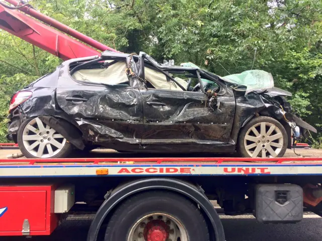 Damaged car on tow-truck