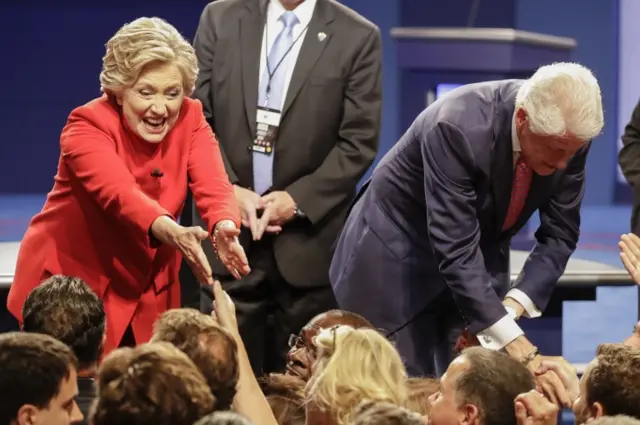 Bill and Hillary Clinton greet fans after the debate