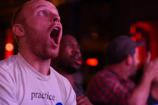 Clinton supporters watch the debate at a bar in West Hollywood, California