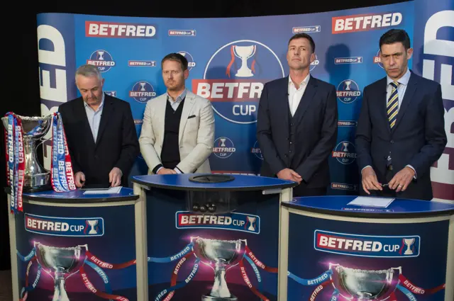 Michael Stewart (centre-left) and Chris Sutton prepare to make the draw for the Betfred Cup semi-finals alongside SFA official Anton Fagan (right)