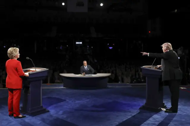 First presidential debate - Donald Trump points across the stage at Hillary Clinton