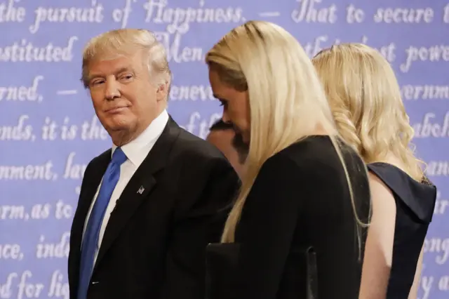 Donald Trump leaves the debate with family