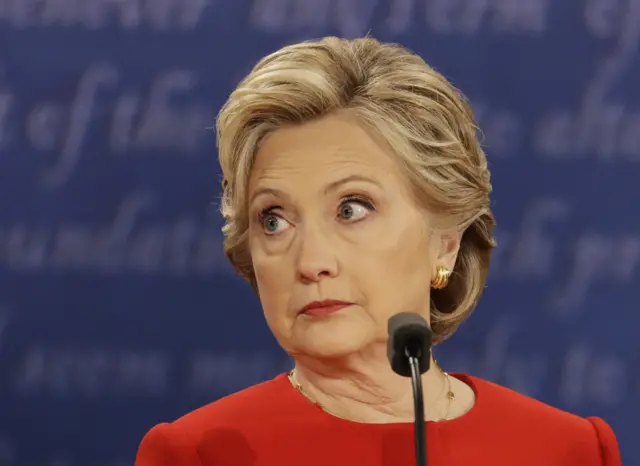 Hillary Clinton listens to Donald Trump during the debate