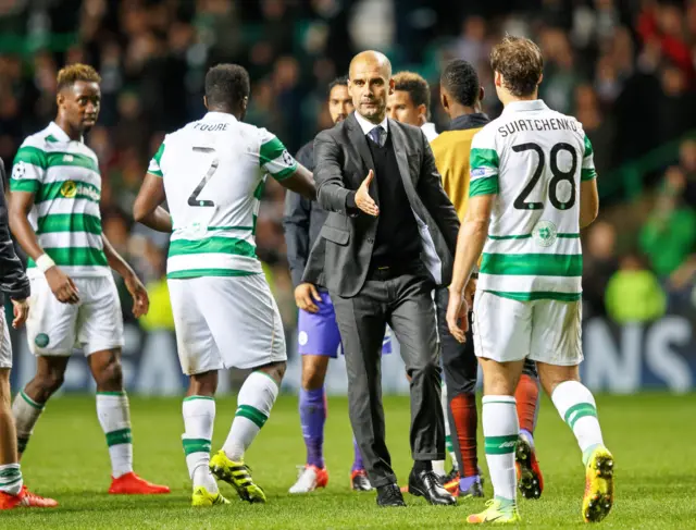 Pep Guardiola shakes hands with Celtic players