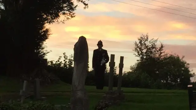 Bugler against a sunset