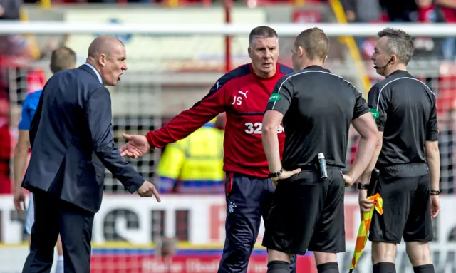 Mark Warburton (left) has words with referee John Beaton at Pittodrie