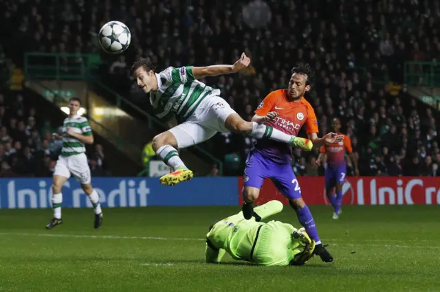 Erik Sviatchenko in action with Manchester City"s Claudio Bravo and David Silva