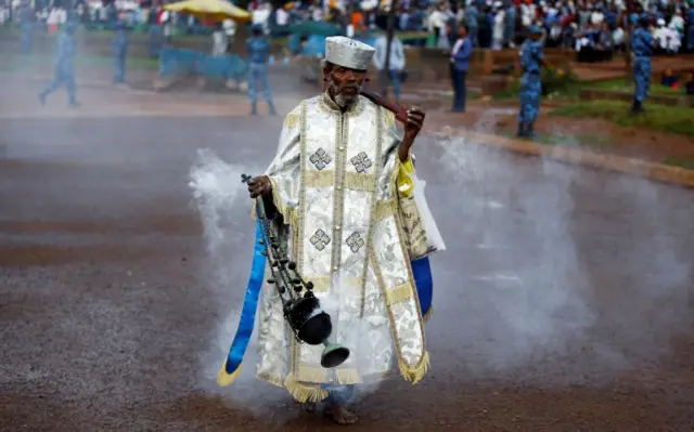 An Ethiopian Orthodox priest blesses the faithful with incense during the Meskel Festival to commemorate the discovery of the true cross on which Jesus Christ was crucified