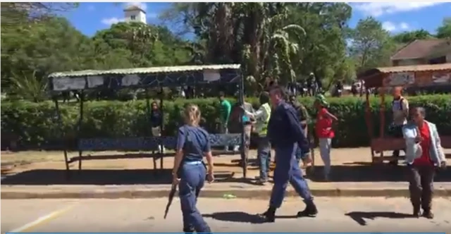 .One student, in a red t-shirt, confronts the police and criticise their heavy-handed tactics